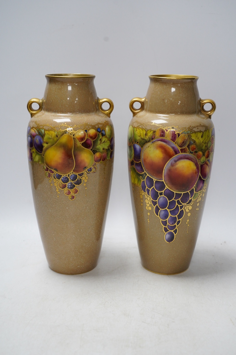 A pair of Worcester vases, decorated with fruit and berries, model number 2768, 26cm. Condition - good